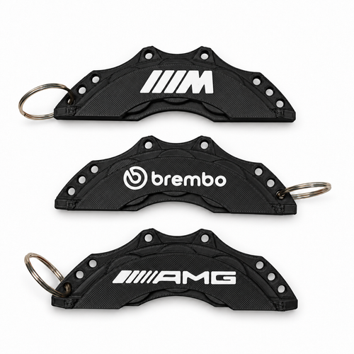 Black and white colour mock-up of M, Brembo and AMG brake caliper keyrings