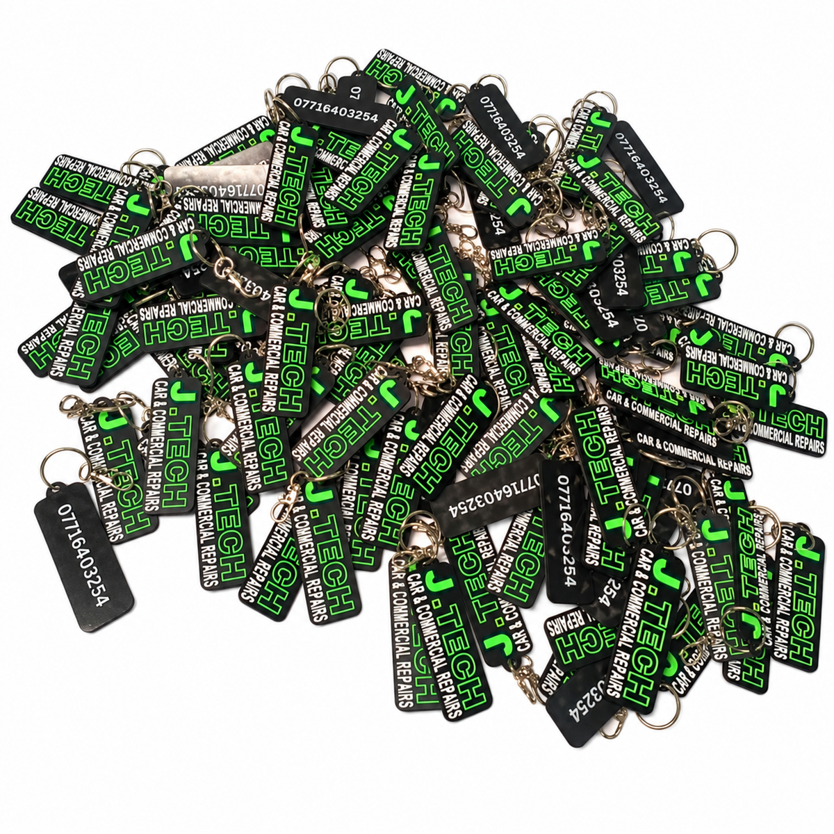 Custom black green and white bulk keyrings on white background